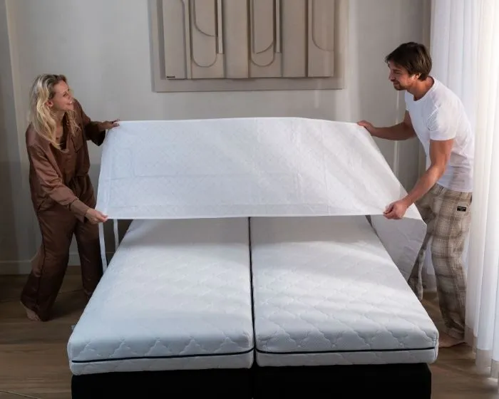 Step 1: slide the Bedbinder under both mattresses