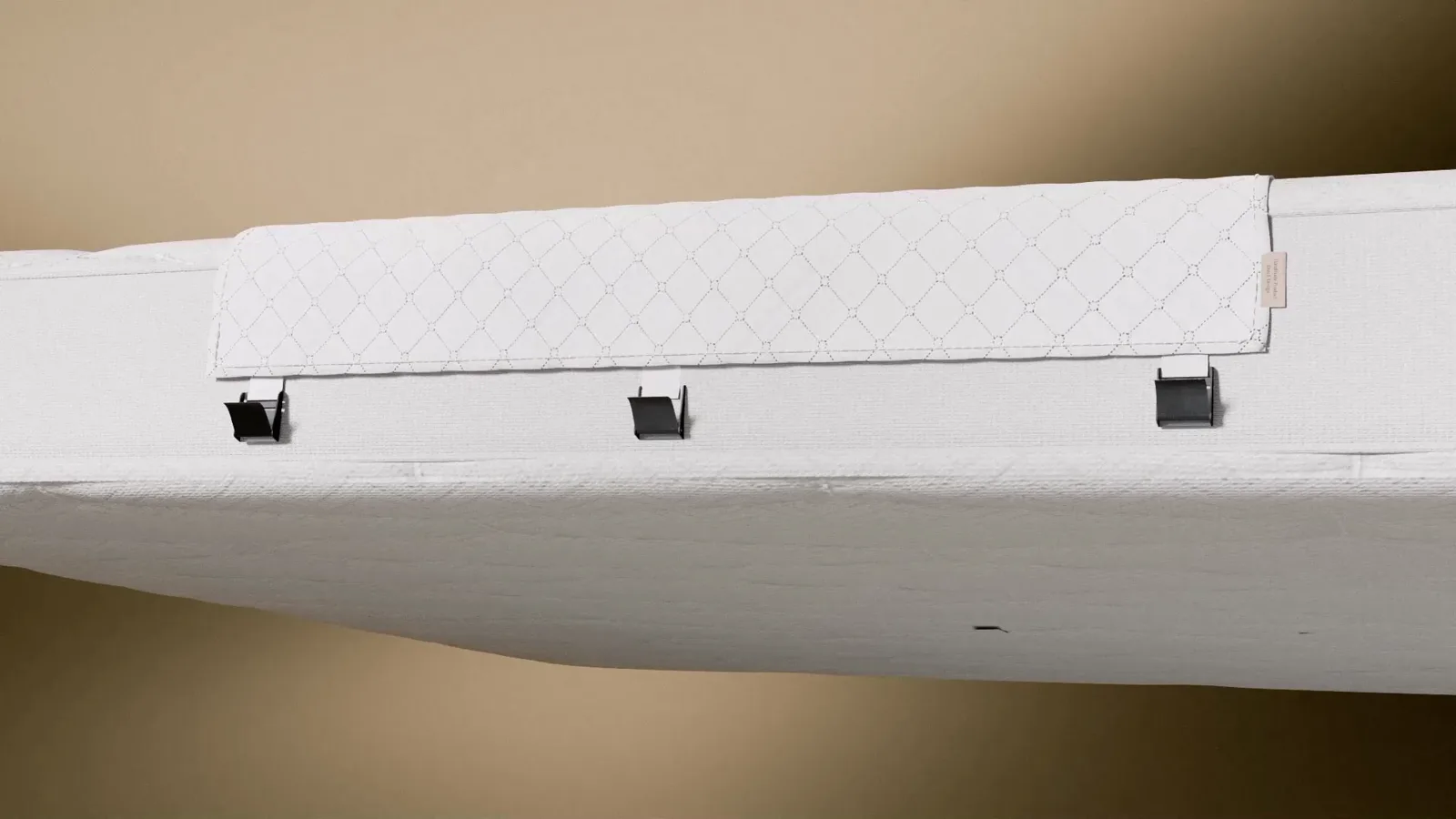 Side profile of the Bedbinder Deluxe straps and buckles holding two mattresses in place