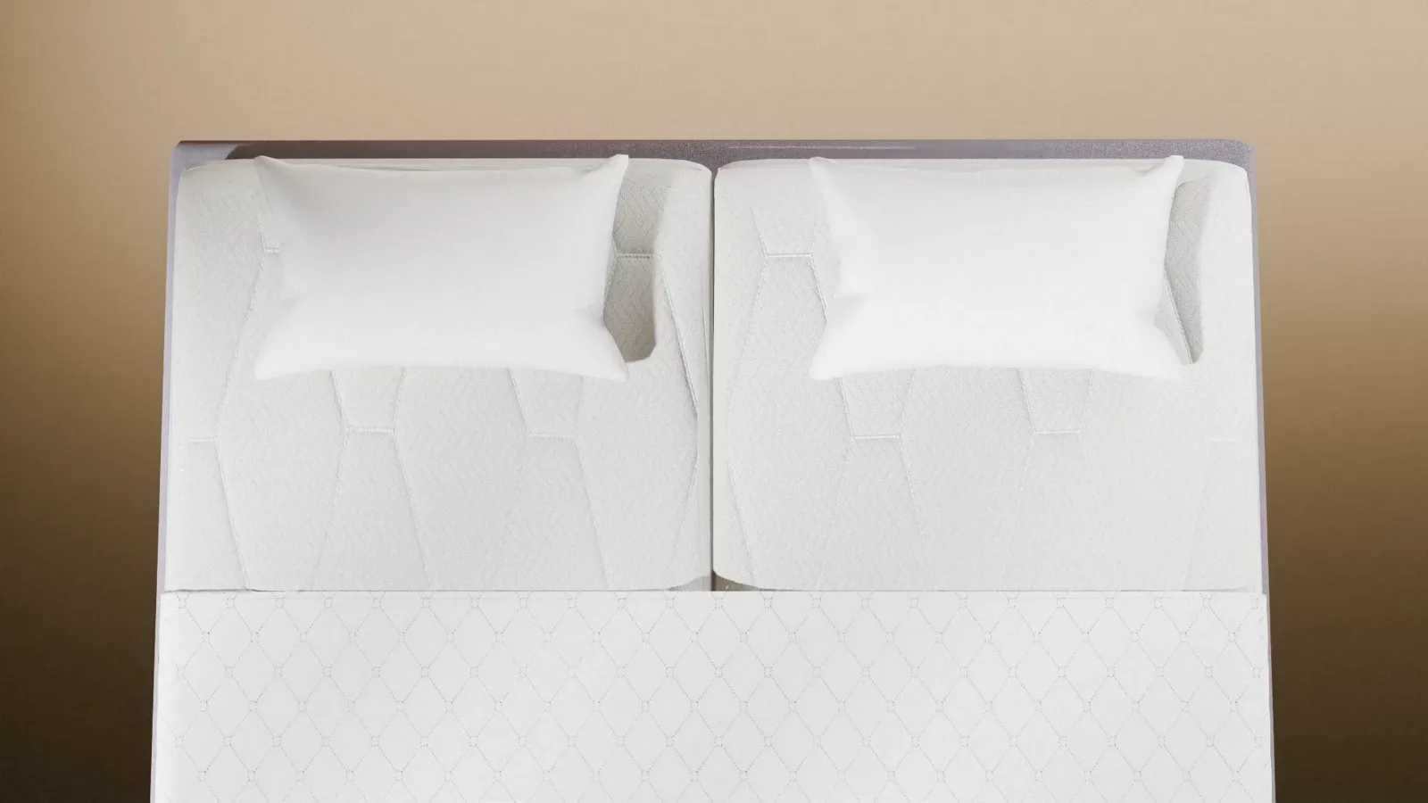 One smooth king size sleeping surface created by connecting two single mattresses